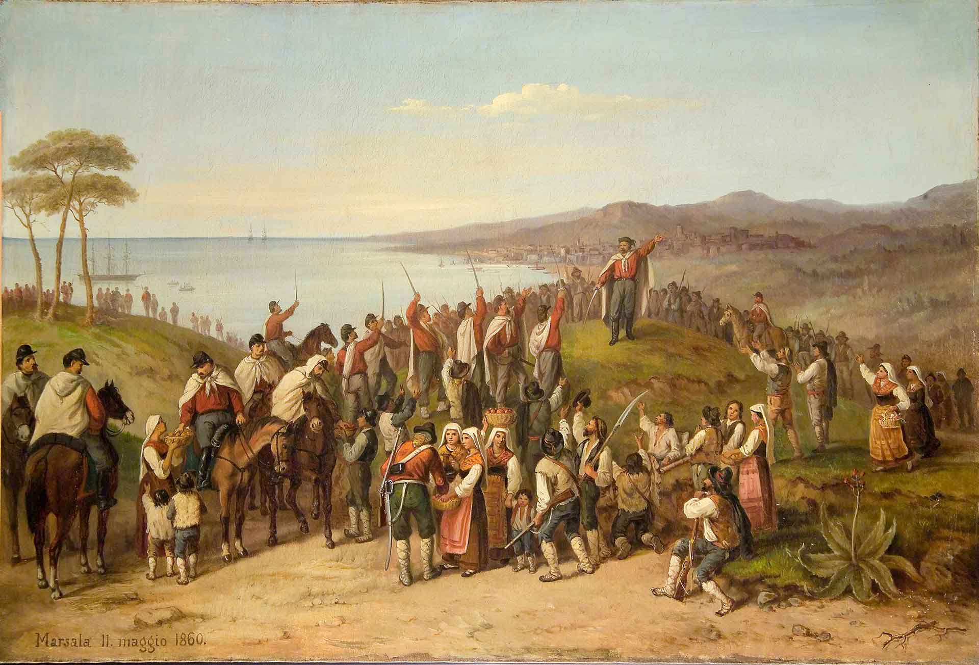 collina vicino al mare. A sinistra in alto il mare, a destra e in primo piano la costa. In primo Piano si vede Garibaldi in cima alla collinetta e sotto tutte le persone che lo acclamano. Vicino a lui soldati garibaldini a cavallo, ma sono presenti anche popolani
